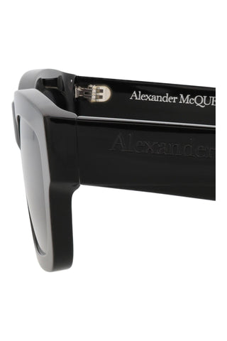Alexander McQueen shiny black recycled acetate sunglasses with square frame and embossed logo detail on the temple.