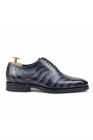 Ambrogio Sirocco wholecut Oxford in hand-painted blue calfskin with wave texture and chisel toe.