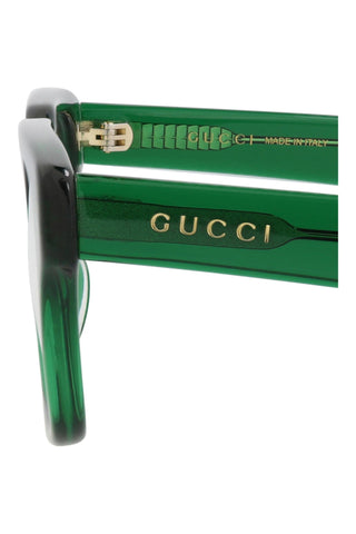 Gucci GG0963O transparent green acetate square eyeglasses with gold logo detail on the temple, made in Italy.