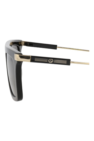 Gucci GG1437S men's square sunglasses in shiny black recycled acetate with gold temple accents and GG logo.