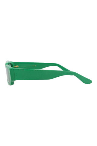 Gucci men's square sunglasses in shiny green recycled acetate with embossed Guccissima logo pattern on the temples.