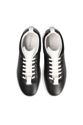 Black Italian leather sneakers with white laces, white interchangeable tongues, and a cushioned rubber sole.